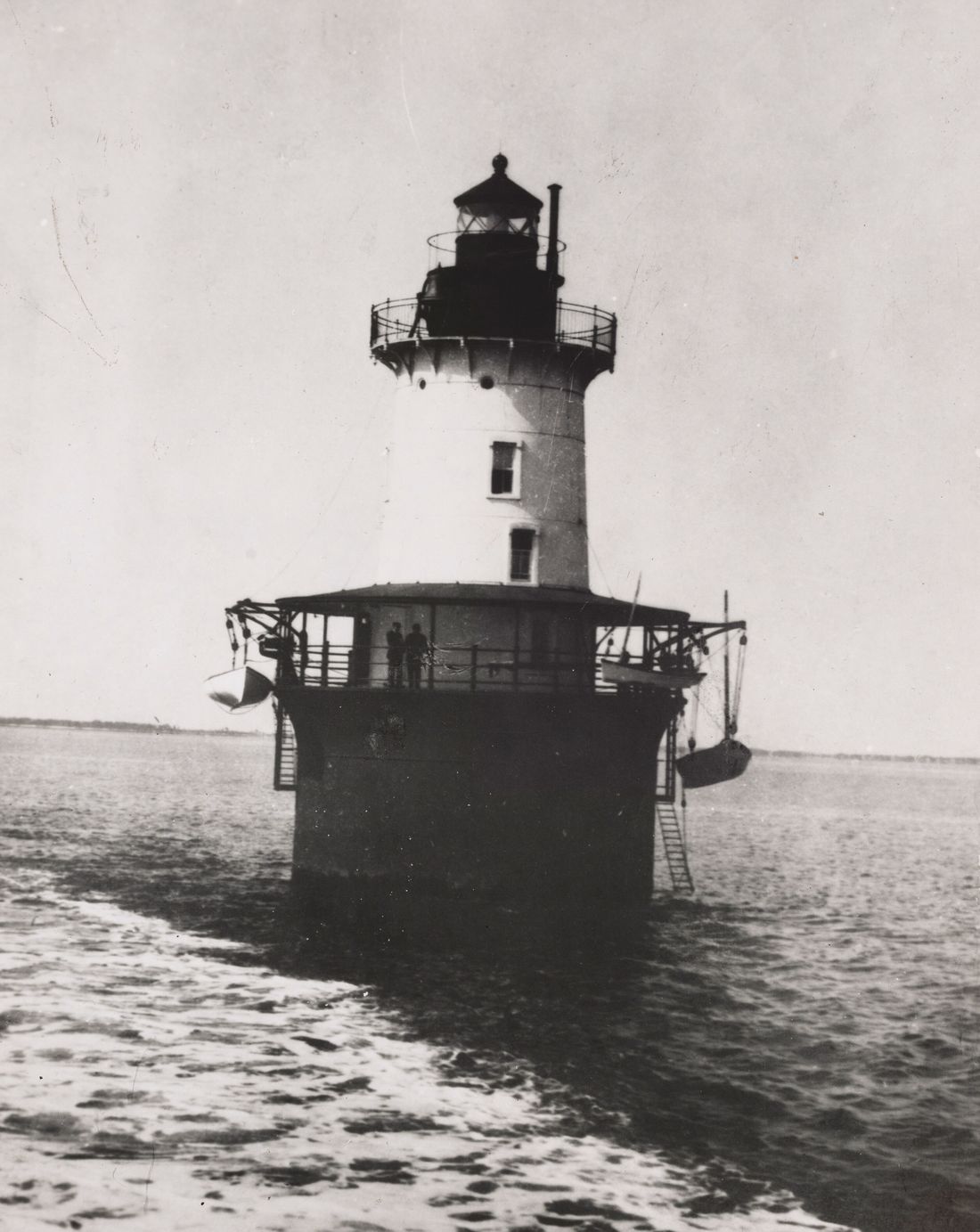Historic black-and-white photograph of the Hooper Island Lighthouse standing on its caisson in open water