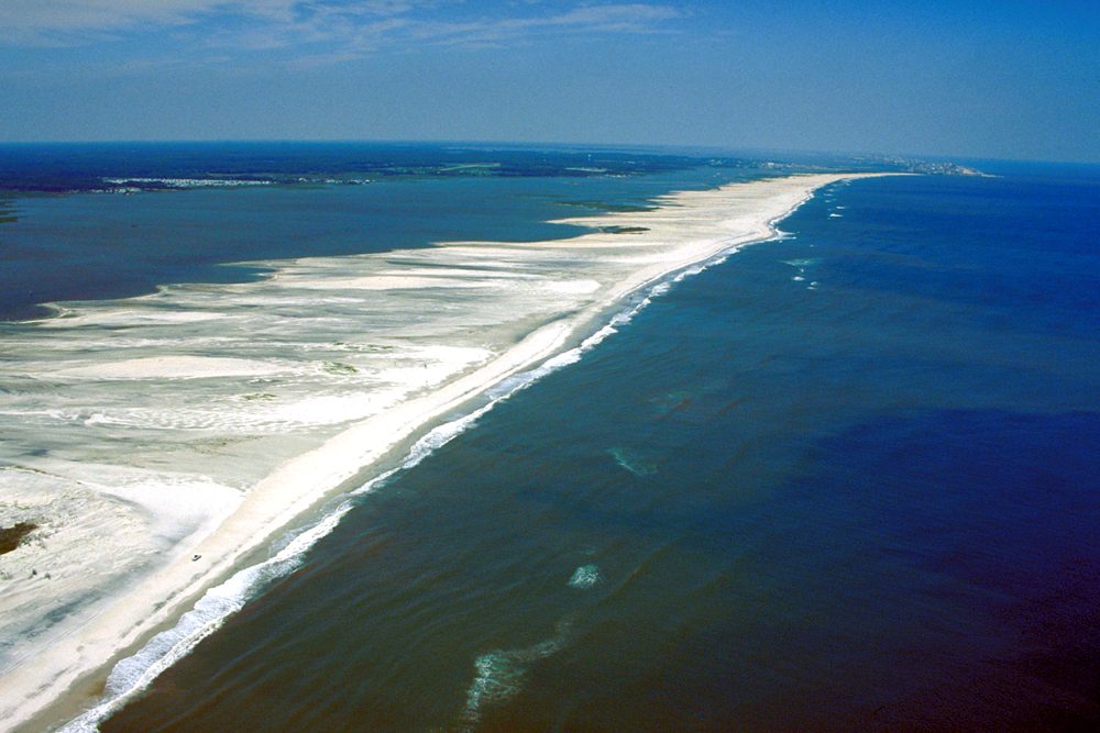 Aerial view of Assateague Island's long white beach between the bay and the Atlantic Ocean in Worcester County, Maryland